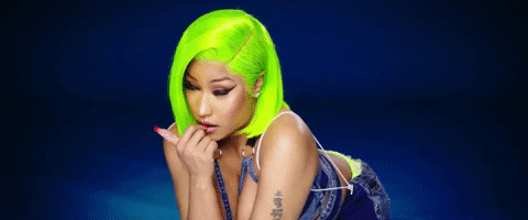 Hair colors: Nicki Minaj winking with bold lime green hair