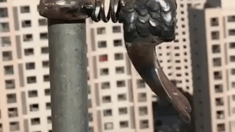 Metal woodpecker