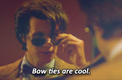 Dr. Who staring in front of a mirror checking himself out with the text 'bow ties are cool'