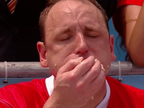 Joey Chestnut feasting on hot dogs