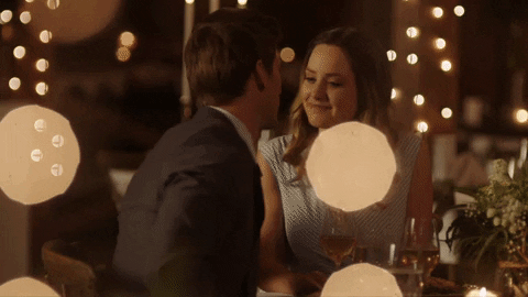Gif of couple kissing at a wedding reception.