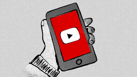 the YouTube logo on a phone screen in a hand