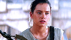 Rey sits panting while holding her weapon on her shoulder. Rey sits panting while holding her weapon on her shoulder.