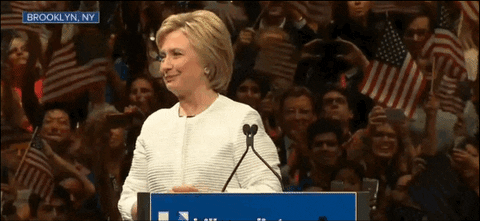 Politician Hilary Clinton smiles at crowd