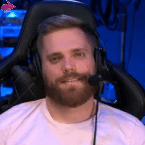 a man wearing headphones and saying he needs coffee
