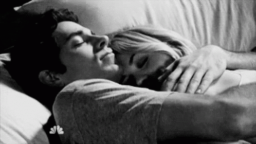 couple hugging and sleeping on bed | credits: giphy.com