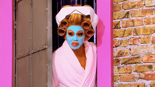 Gif of woman in blue face mask shutting door