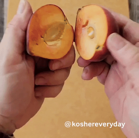 This is how to split the peach into two halves.