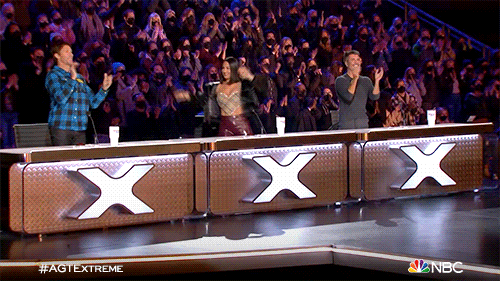 The X factor, with the hosts clapping and high-fiving each other.