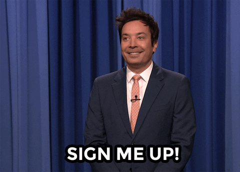 The Tonight Show Starring Jimmy Fallon host Jimmy Fallon mouthing 'Sign me up' with text with the same words laid over the visual at the bottom of the GIF.