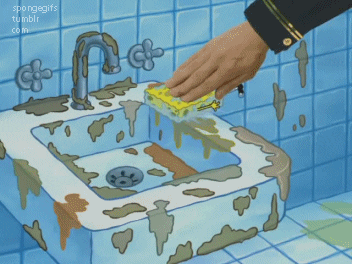 A sponge cleaning a dirty sink