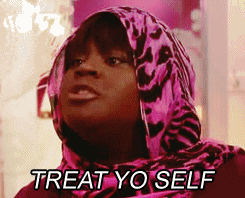 A woman wearing a pink animal print scarf on her head saying treat yo self