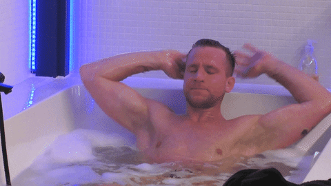 A man relaxing in a bathtub