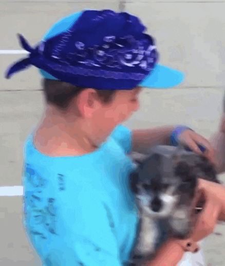 kid crying tears of joy when handed puppy