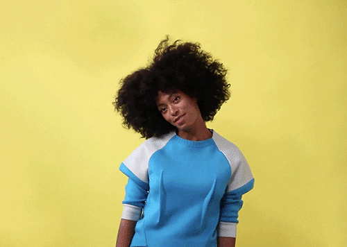 solange with long black African hair dancing carefree
