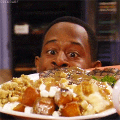 Gif of a man staring at eye level with a plate of food.