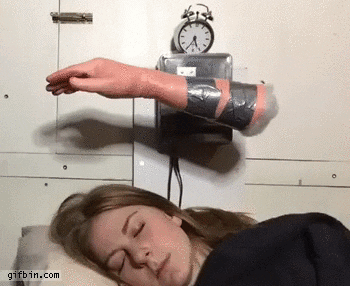 Girl gets slapped by an alarm clock