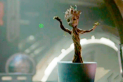 Groot from guardians of the galaxy dancing in a flower pot.