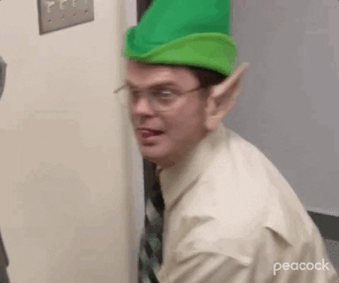 dwight schrute with an elf hat