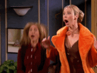 Actresses Jennifer Aniston and Lisa Kudrow from FRIENDS jumping up and down and clapping excitedly