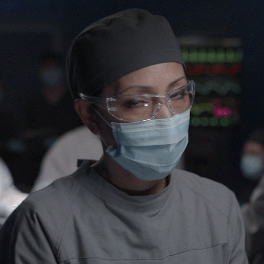 doctor with a facemark on, looking 