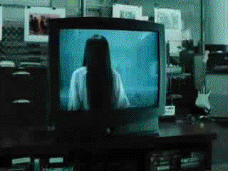 Scene from The Ring where the demon Samsara crawls out of the tv and the haunted tape