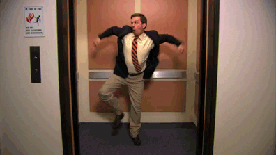 A GIF of Andy Bernard from The Office dancing in an elevator