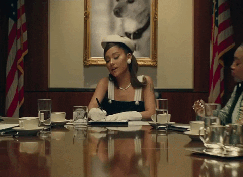 GIF of Ariana Grande writing and being engaging