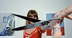 woman showing scissors