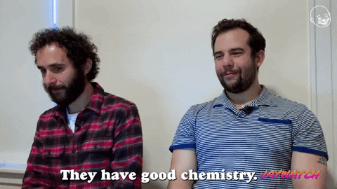 Two men laughing about a joke saying "They have good chemistry."