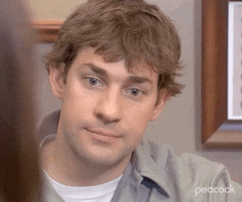 The Office: Jim Halpert looks straight at the camera, puffs out his cheeks and raises his eyebrows