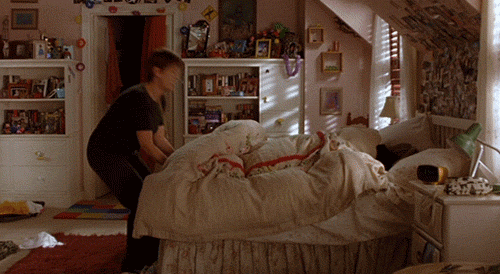 GIF of someone being pulled out of bed