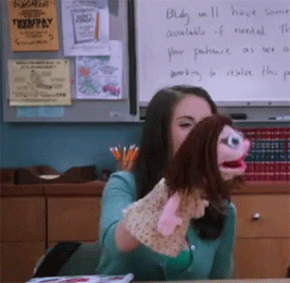 gif of TV show Community character making a puppet talk and talk and talk. talking with kids about sex