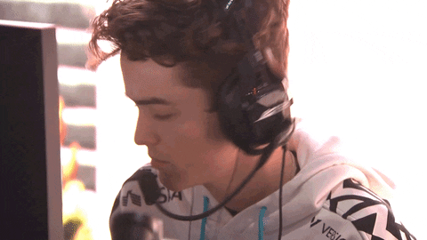 Young man in a headset pulling a stank face, nodding along