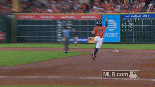 GIF: Jose Altuve ranges very, very far to his left to make