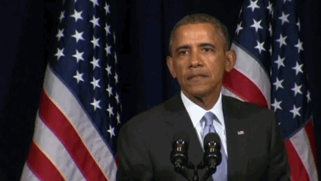 Barrack Obama at a press conference reacting with dismay to a question that's been asked..