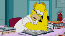 A GIF of Homer Simpson studying while looking frazzled 