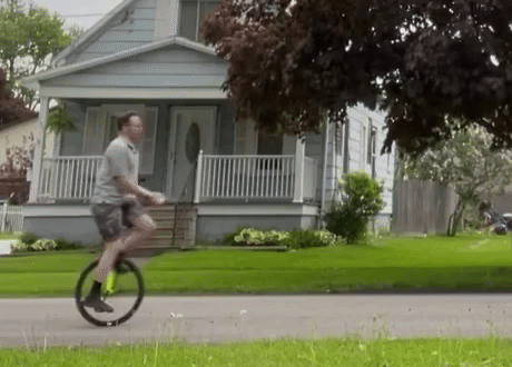 Person juggling several objects on a unicycle, attempting too many things at once