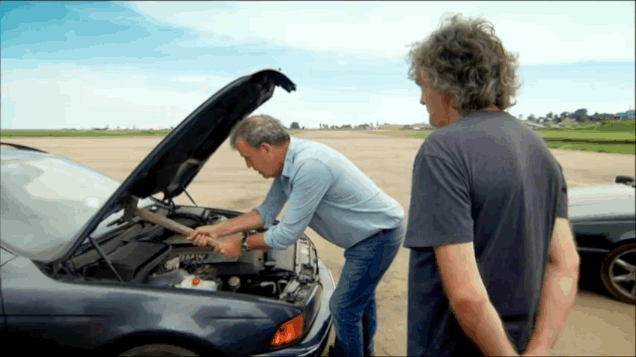 man fixing his car gif