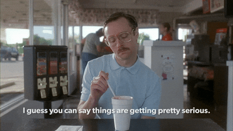 Men drinking coffee GIF and says "I guess you can say things are getting pretty serious."