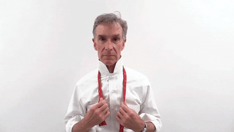 bill nye puts on a bow tie and looks awesome doing it 