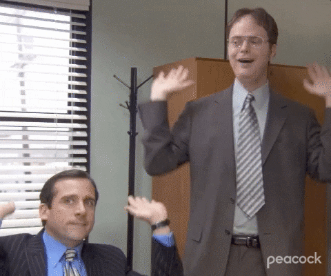 Characters from The Office dancing with excitement. 