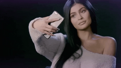 a gif of Kylie Jenner taking a selfie