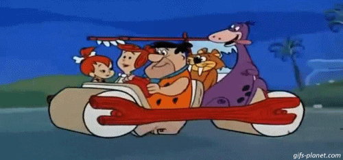 The Flintstones driving a car.