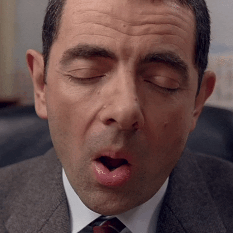 Mr. Bean falling asleep and then startling awake.