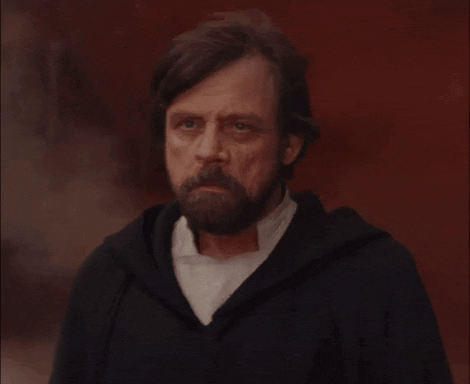 Luke Skywalker brushing ash off his shoulder