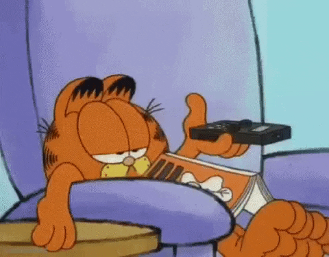 a GIF of Garfield watching TV absent-mindedly