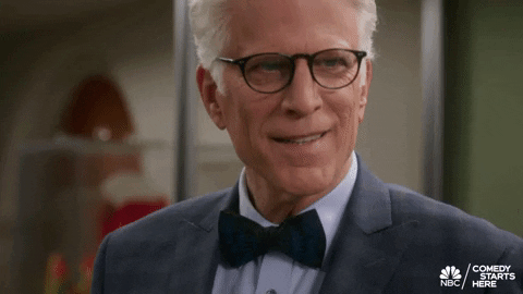Ted Danson smiling, wickedly
