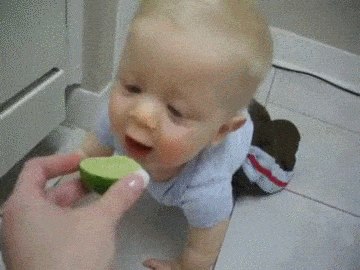 baby eating lime