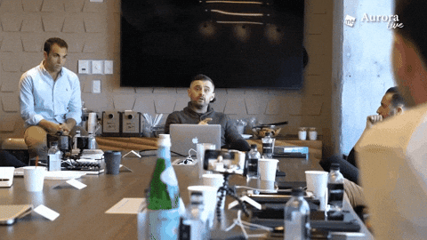 A person nervously pitching their boss in a small meeting room